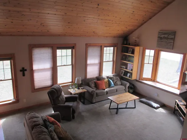 a living room with furniture and windows