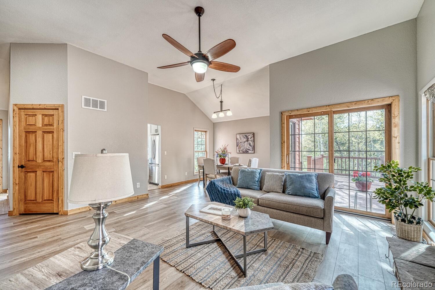 318 Southgate Road Florissant, CO 80816 - Photo 13 of 48 a living room with furniture and a large window