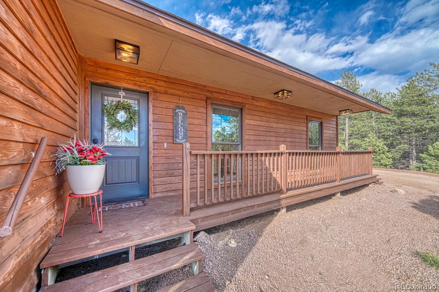 318 Southgate Road Florissant, CO 80816 - Photo 2 of 48 a view of a house with a porch