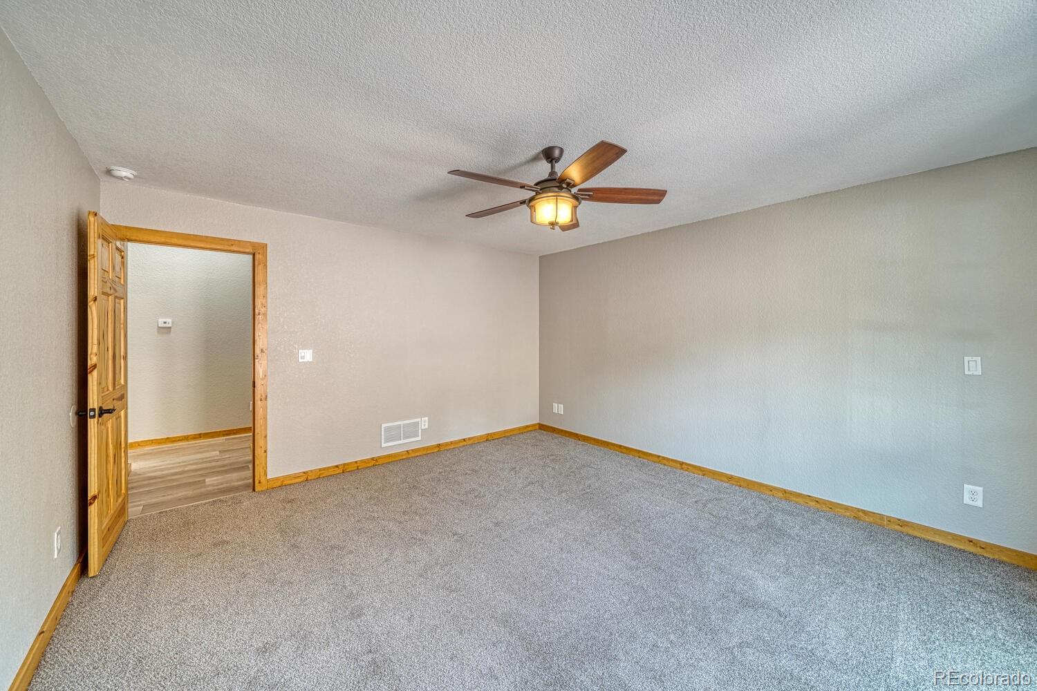 318 Southgate Road Florissant, CO 80816 - Photo 22 of 48 an empty room with a window and a fan