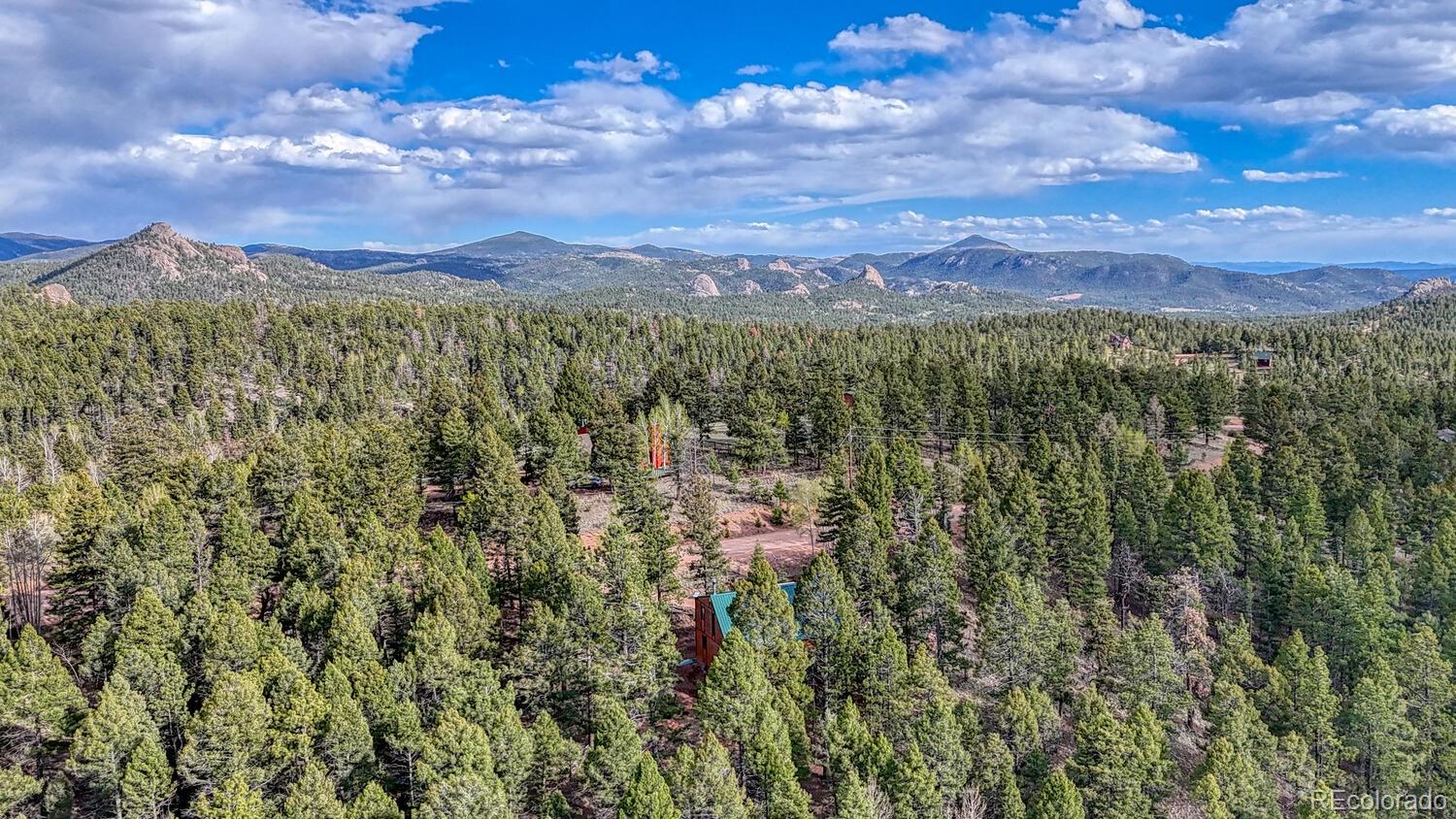 318 Southgate Road Florissant, CO 80816 - Photo 37 of 48 a view of a city with lush green forest