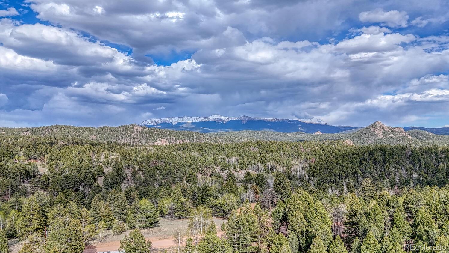 318 Southgate Road Florissant, CO 80816 - Photo 39 of 48 a view of a city with lush green forest