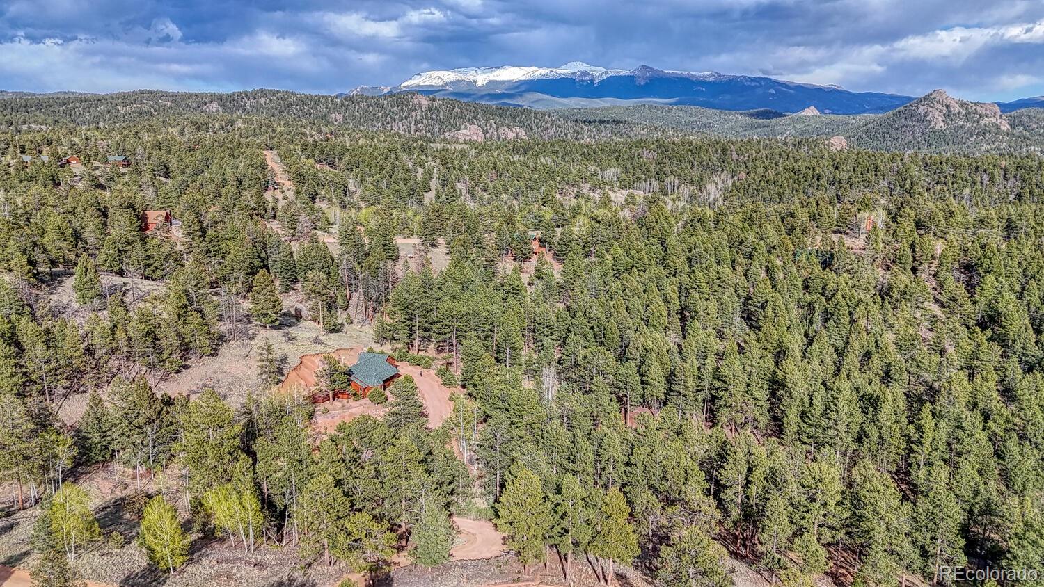 318 Southgate Road Florissant, CO 80816 - Photo 43 of 48 a view of a city with mountains in the background