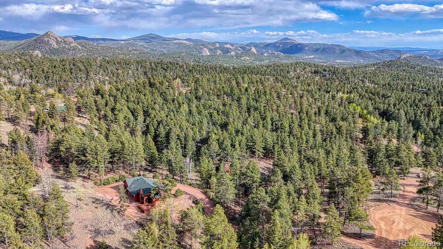 318 Southgate Road Florissant, CO 80816 - Photo 44 of 48 a view of a city with mountains in the background
