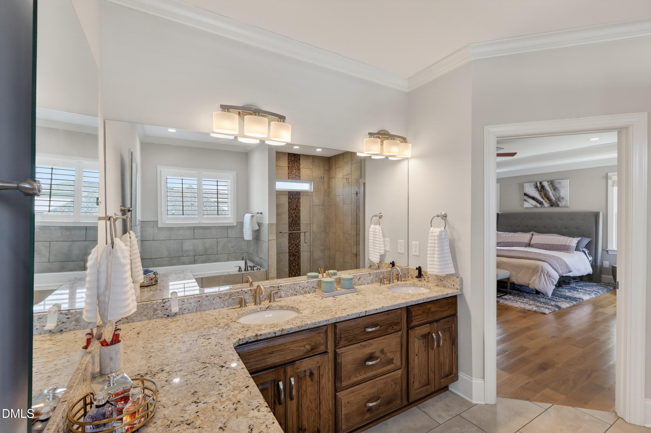 261 Character Drive Rolesville, NC 27571 - Photo 37 of 77 a bathroom with a tub sink and mirror
