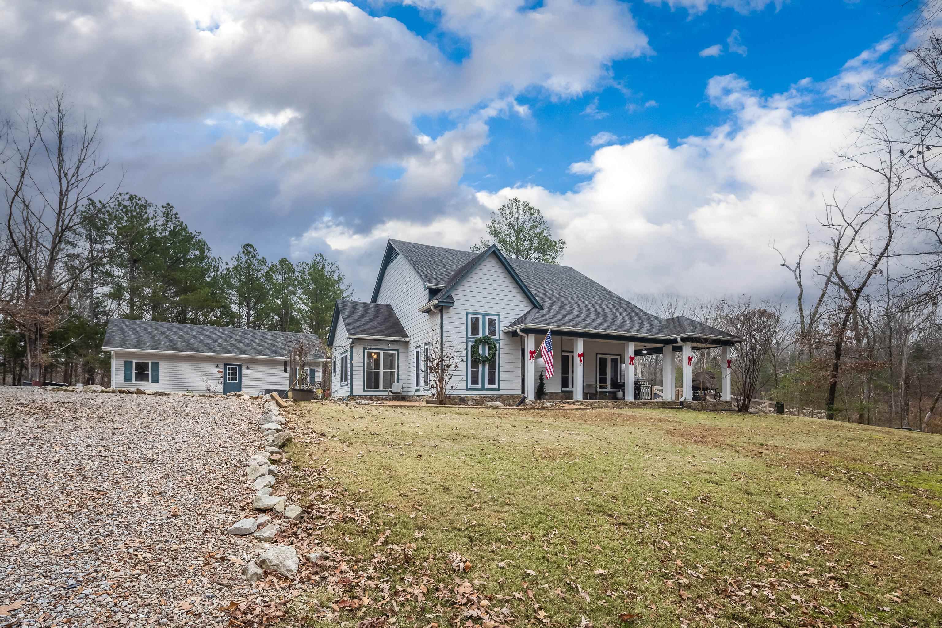 1755 Country Club Road Somerville, TN 38068 - Photo 11 of 40 a view of a house with a big yard and large trees