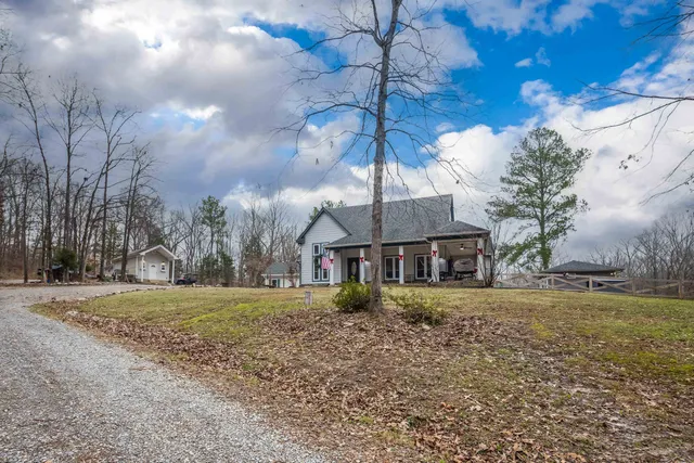 a view of a a dining room with furniture window and wooden floor