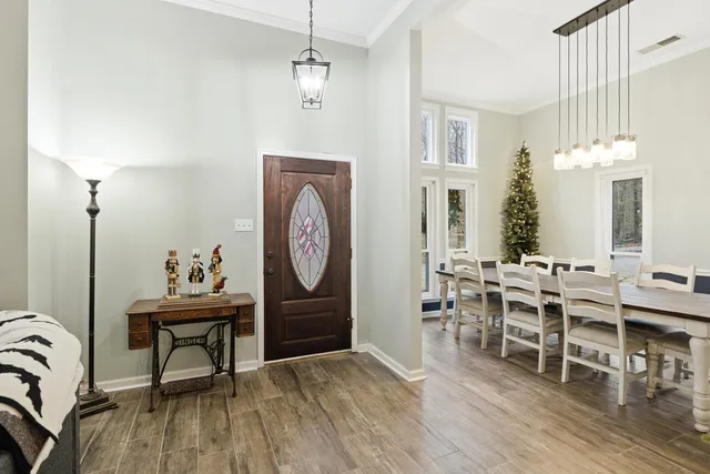 a view of a dining room with furniture window and wooden floor