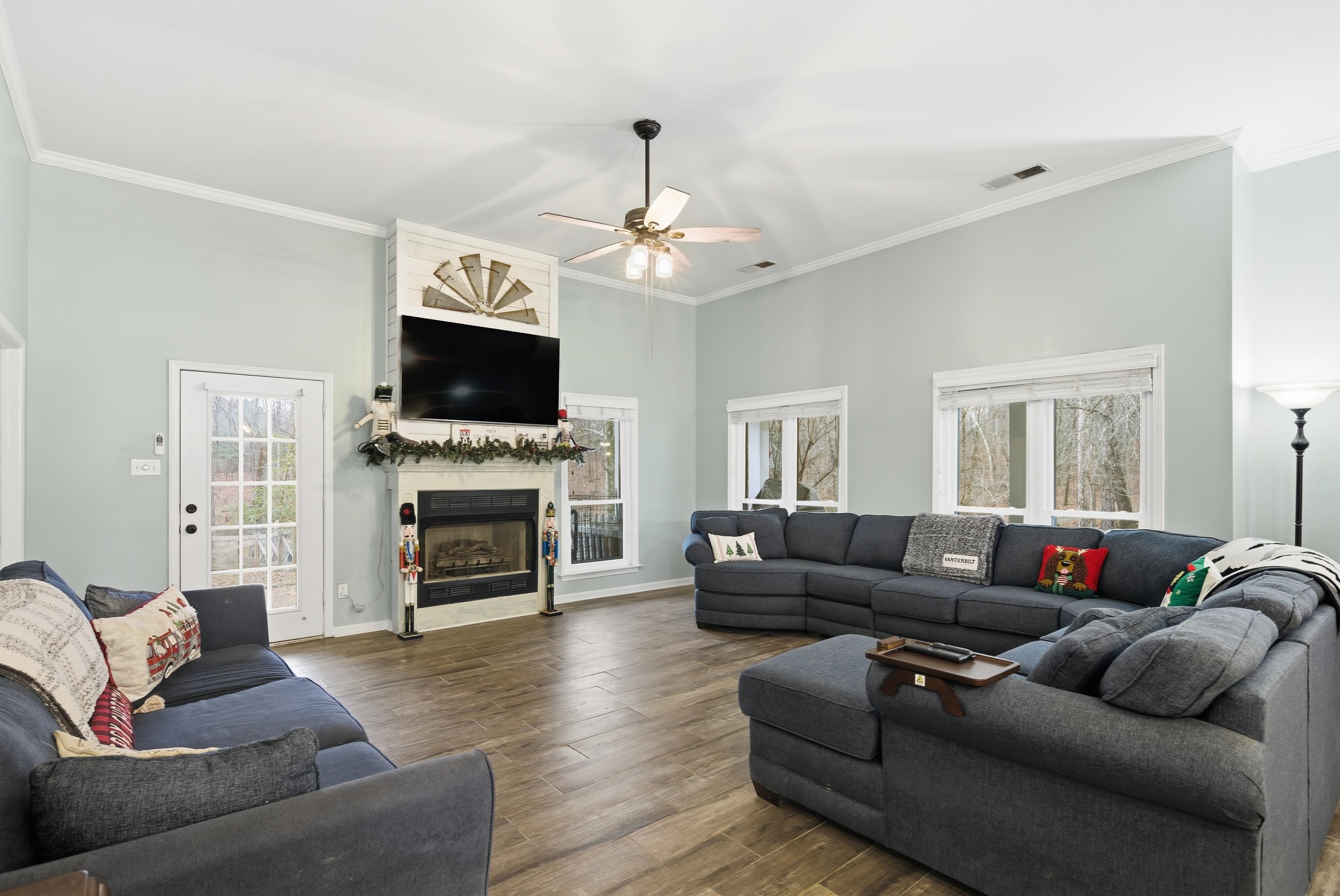 1755 Country Club Road Somerville, TN 38068 - Photo 18 of 40 a living room with furniture a fireplace and a flat screen tv