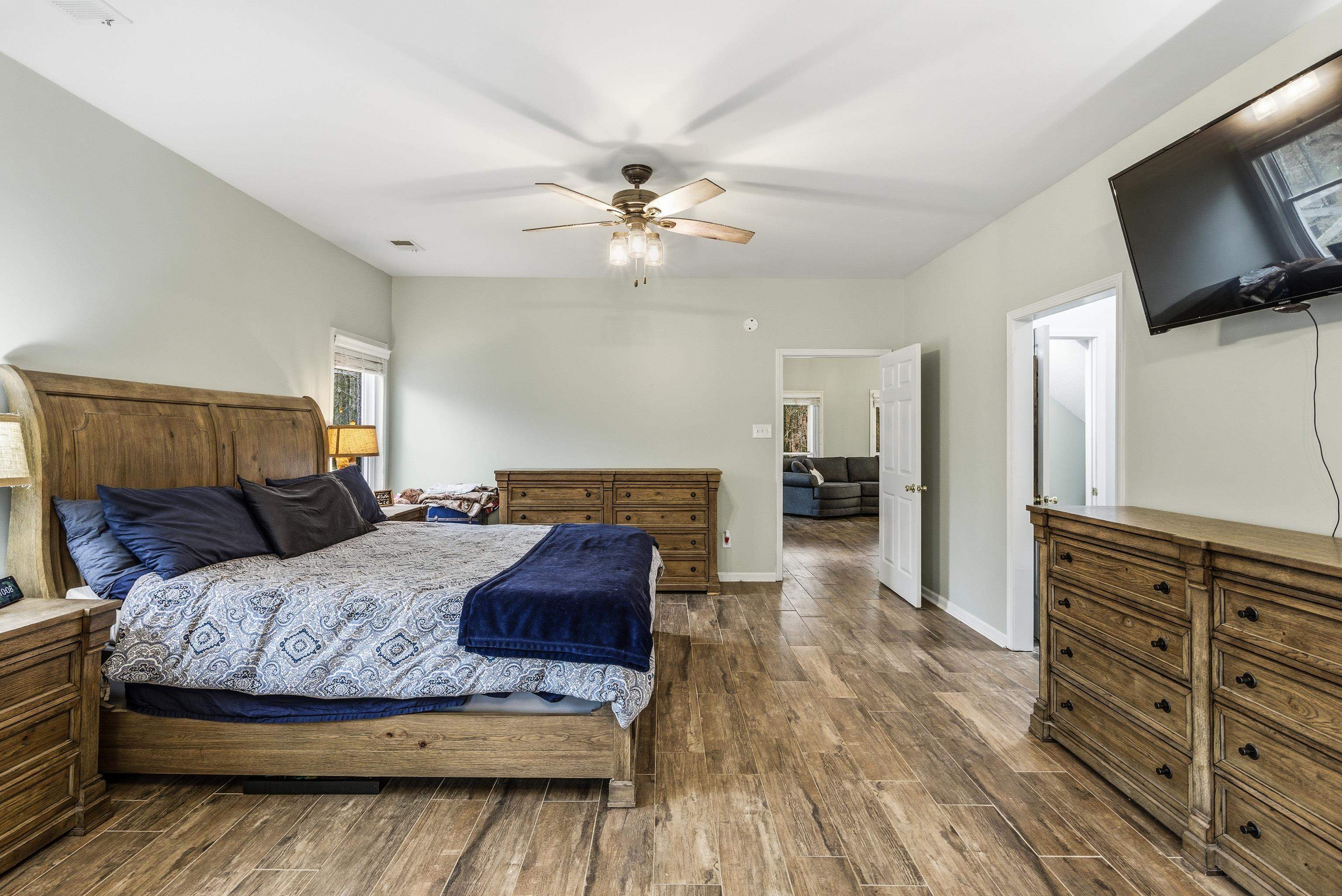 1755 Country Club Road Somerville, TN 38068 - Photo 28 of 40 a bedroom with a bed and a television