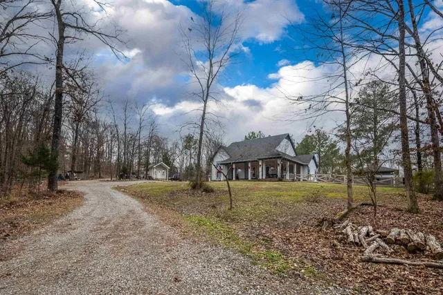 a view of a house with a snow in the yard
