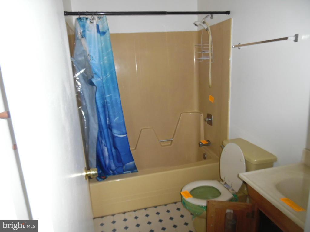 144 Farm Road Aberdeen, MD 21001 - Photo 11 of 12 a bathroom with a shower curtain and a sink