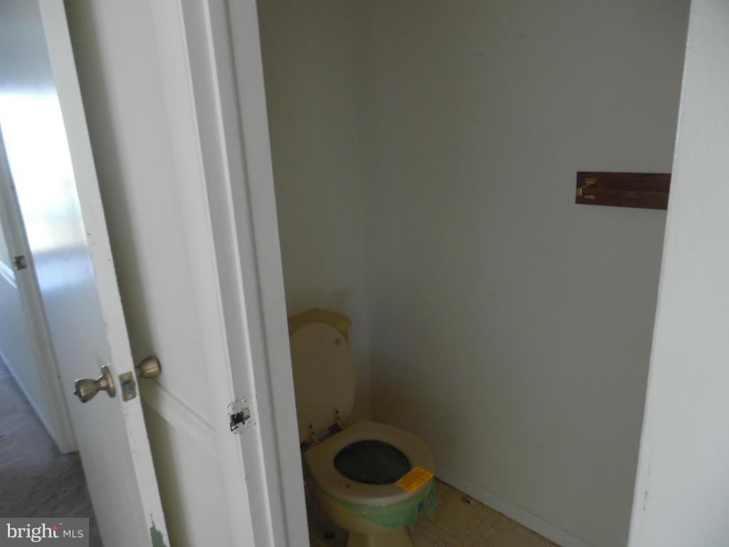 144 Farm Road Aberdeen, MD 21001 - Photo 5 of 12 a small space with a sink and toilet