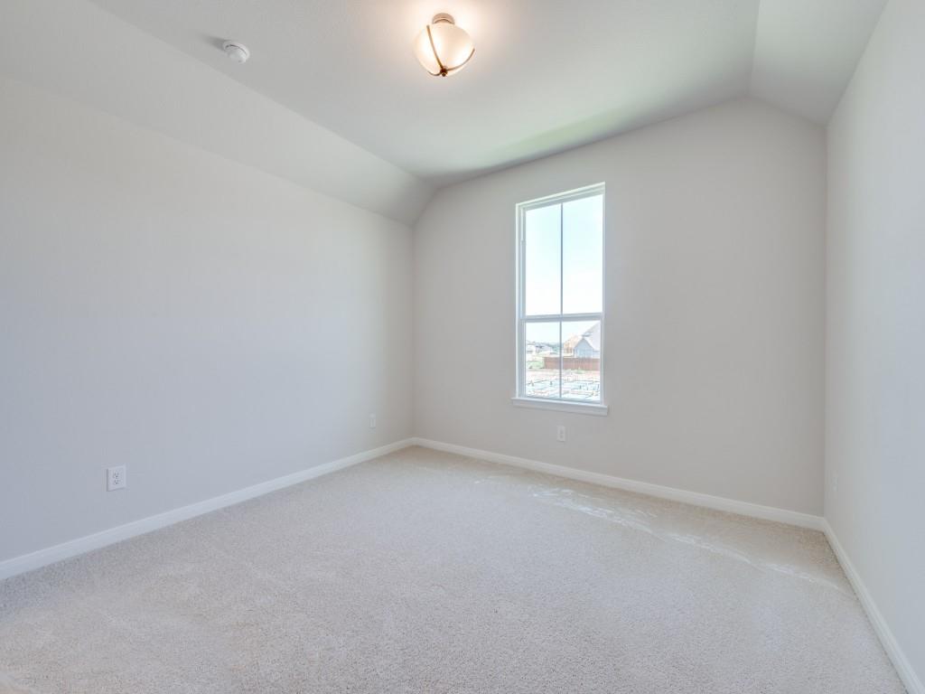 14565 Helena Street Pilot Point, TX 76258 - Photo 14 of 17 Our 4202 plan offers several nicely sized secondary bedrooms.