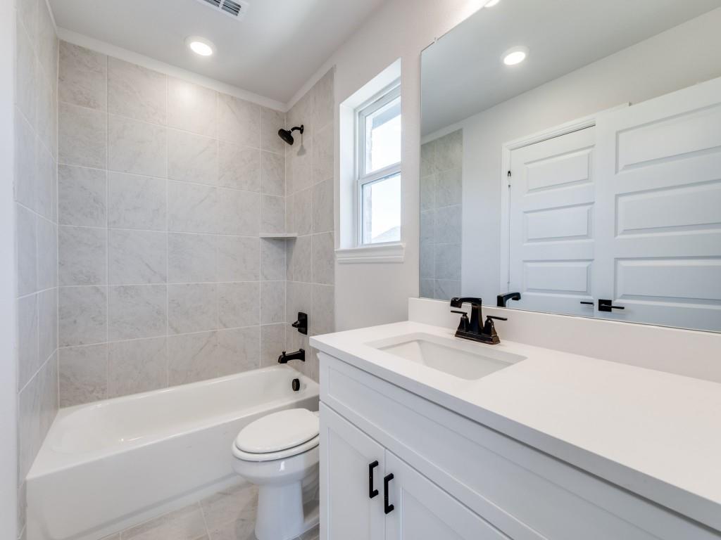 14565 Helena Street Pilot Point, TX 76258 - Photo 15 of 17 Friends and family will feel right at home in any of the guest baths in this dream home!