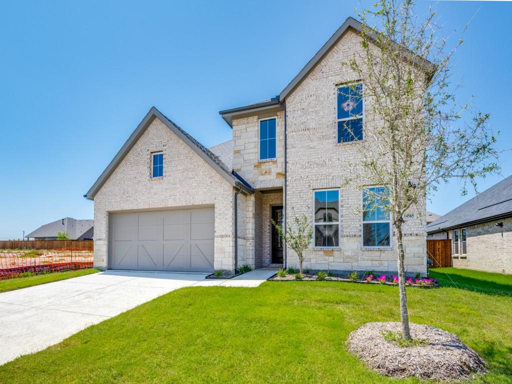 14565 Helena Street Pilot Point, TX 76258 - Photo 3 of 17 With a beautiful mix of brick, stone and complementary trim, this dream home offers fantastic curb appeal!
