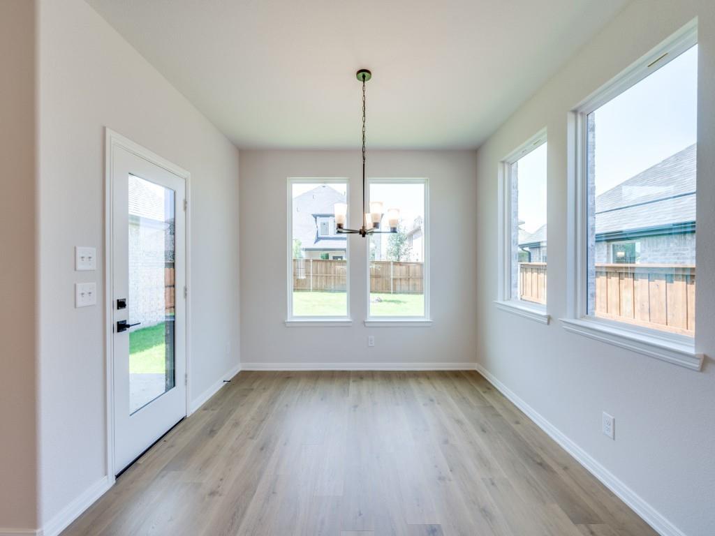 14565 Helena Street Pilot Point, TX 76258 - Photo 6 of 17 With windows everywhere you look, this lovely dining room brings the outside in!