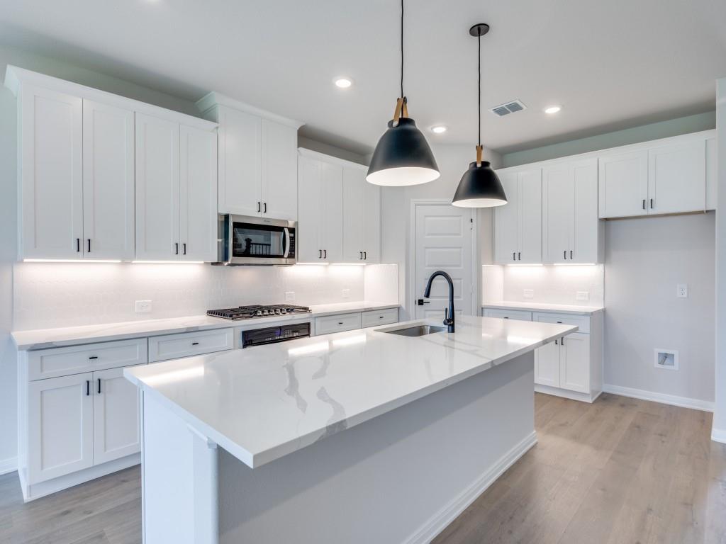 14565 Helena Street Pilot Point, TX 76258 - Photo 7 of 17 You'll find ample storage and prep space in this thoughtfully designed dream kitchen!