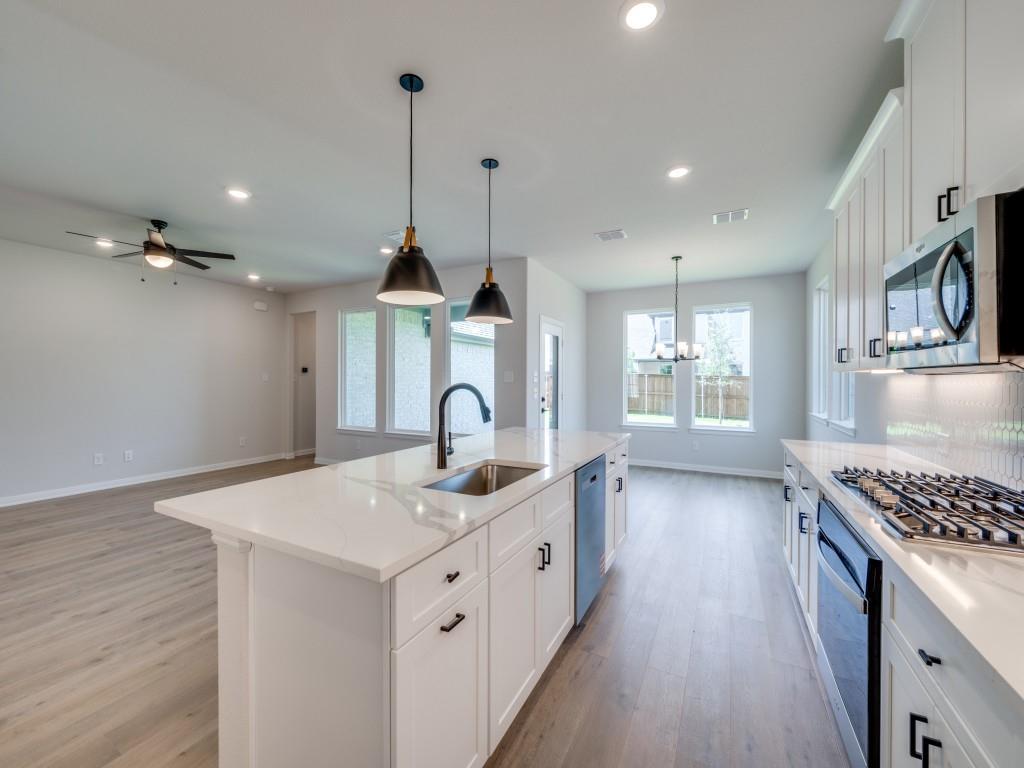 14565 Helena Street Pilot Point, TX 76258 - Photo 9 of 17 The chef will never be left out of the party in this wonderful open concept design.