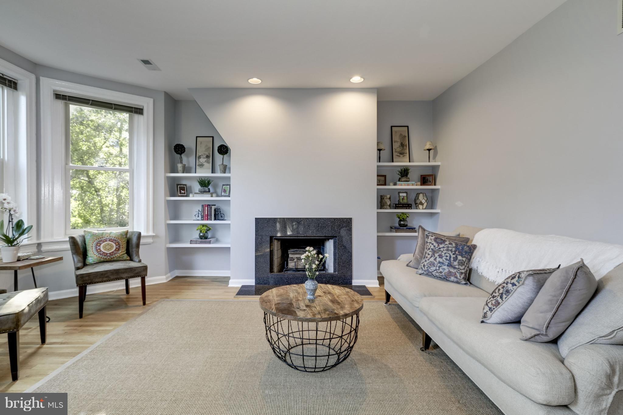 1813 Kalorama Road Northwest, Unit 3 Washington, DC 20009 - Photo 4 of 21 Living room with big bay-windows overlooking trees