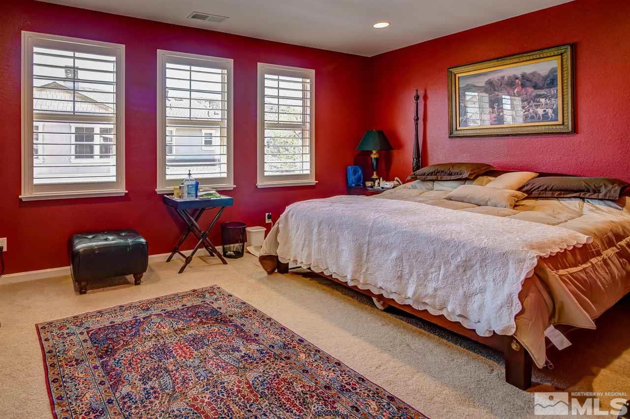 7675 Pebblestone Way Reno, NV 89523 - Photo 13 of 25 a bedroom with bed and window