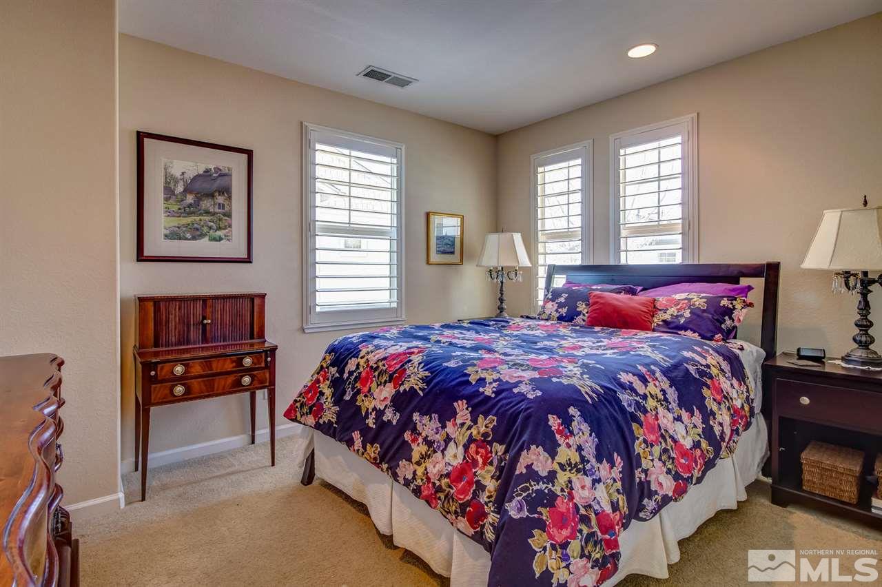 7675 Pebblestone Way Reno, NV 89523 - Photo 16 of 25 a bedroom with bed and window
