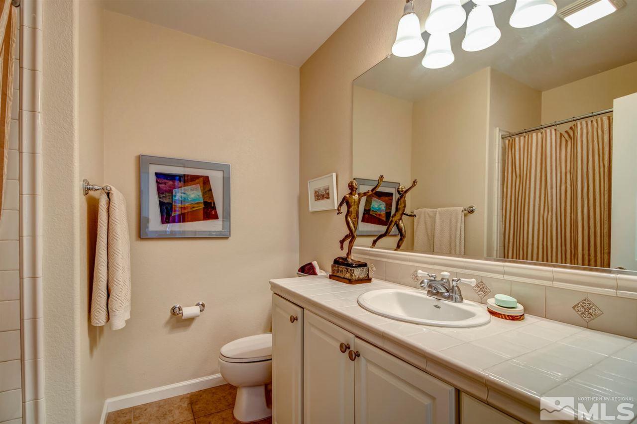 7675 Pebblestone Way Reno, NV 89523 - Photo 17 of 25 a bathroom with a sink and a toilet