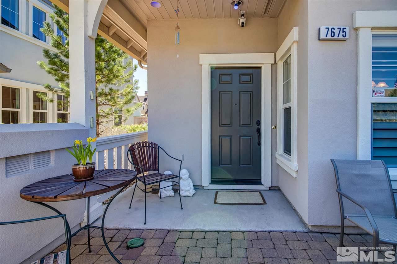 7675 Pebblestone Way Reno, NV 89523 - Photo 2 of 25 a backyard of a house with outdoor seating