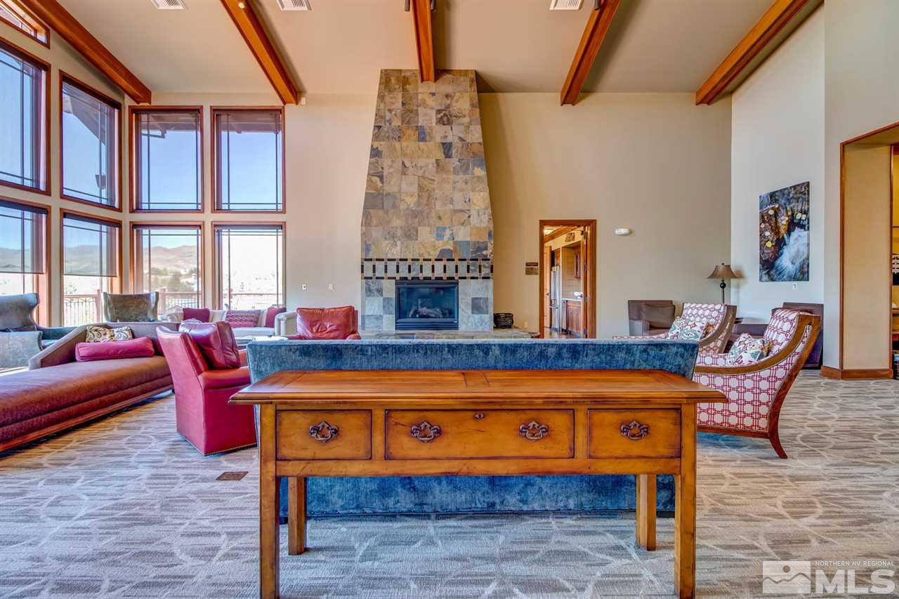 7675 Pebblestone Way Reno, NV 89523 - Photo 24 of 25 a living room with furniture a rug and a window