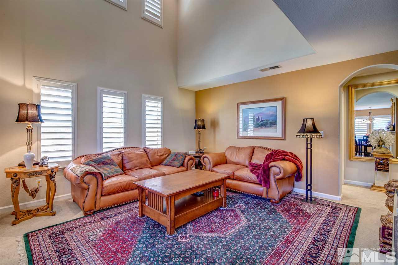 7675 Pebblestone Way Reno, NV 89523 - Photo 4 of 25 a living room with furniture rug and window