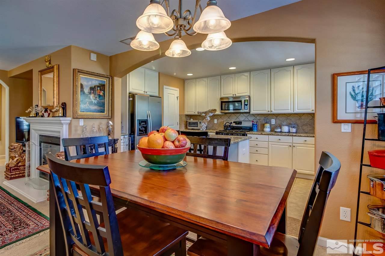 7675 Pebblestone Way Reno, NV 89523 - Photo 7 of 25 a view of a dining room with furniture and chandelier