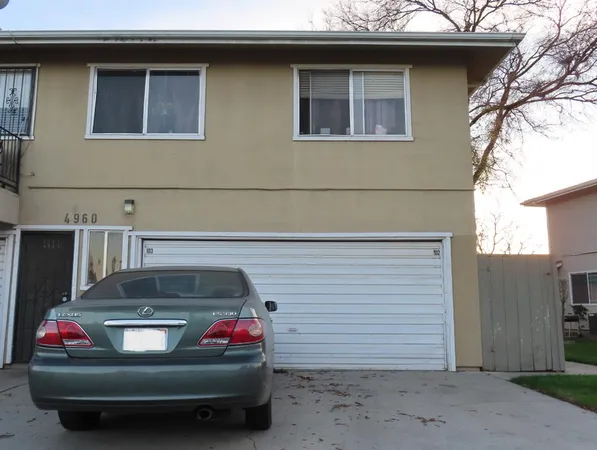 a car parked in front of a house