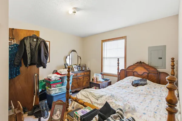 a bedroom with a bed and gym equipment