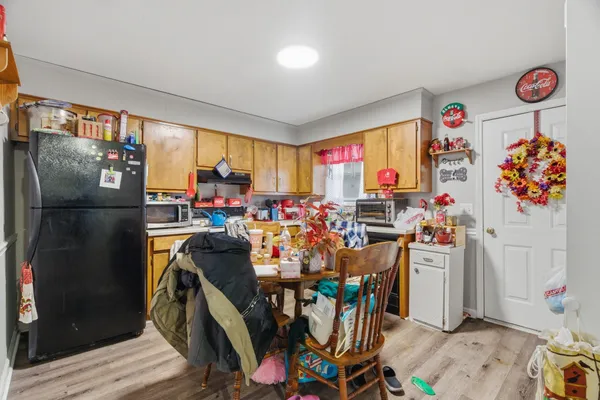 a kitchen that has a lot of cabinets in it