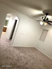 14039 West Country Gables Drive Surprise, AZ 85379 - Photo 12 of 32 en empty room with wooden floor