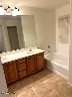 a view of bathroom with bathtub and shower