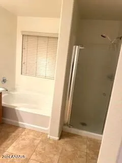 a white toilet sitting next to a white wall