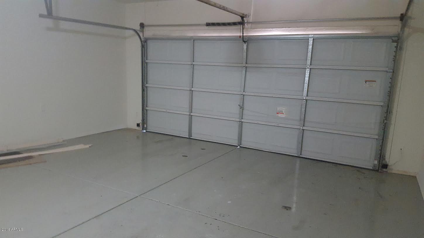 14039 West Country Gables Drive Surprise, AZ 85379 - Photo 28 of 32 a view of a room with racks on the wall