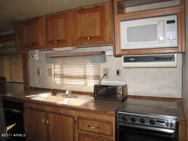 21283 Granite Ridge Road, Unit 304 Congress, AZ 85332 - Photo 3 of 20 Electric stove /Built in Microwave