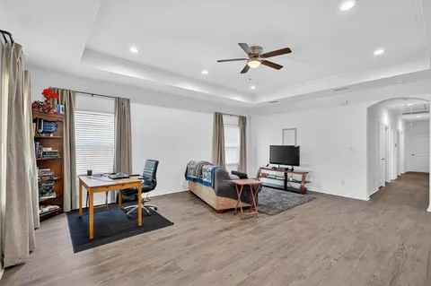 a work room with furniture and wooden floor
