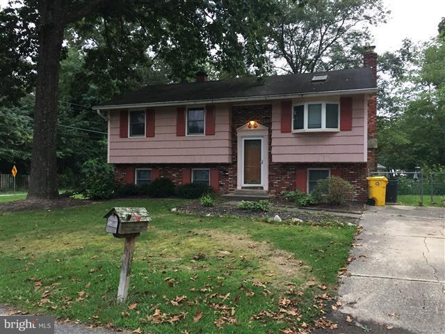 166 Dundee Road Severna Park, MD 21146 - Photo 1 of 25 a front view of a house with a yard