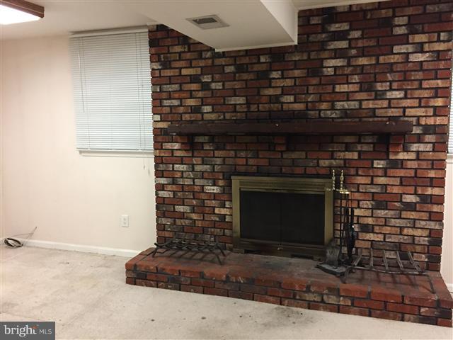 166 Dundee Road Severna Park, MD 21146 - Photo 13 of 25 a living room with fireplace