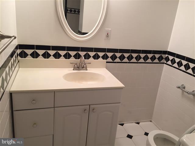 166 Dundee Road Severna Park, MD 21146 - Photo 17 of 25 a bathroom with a sink and a mirror