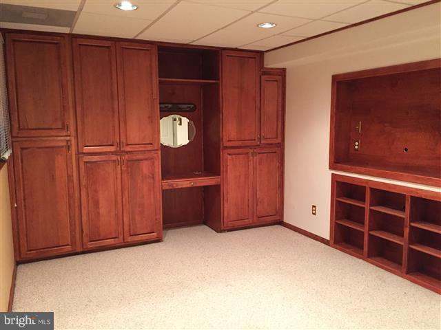 166 Dundee Road Severna Park, MD 21146 - Photo 18 of 25 a view of an empty room with cabinet and mirrors