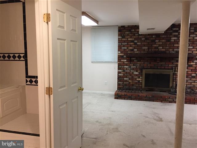 166 Dundee Road Severna Park, MD 21146 - Photo 20 of 25 a bathroom with a fireplace