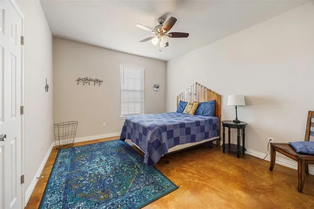 a bedroom with a bed and a table in it