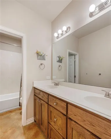 a bathroom with a sink a vanity and a mirror