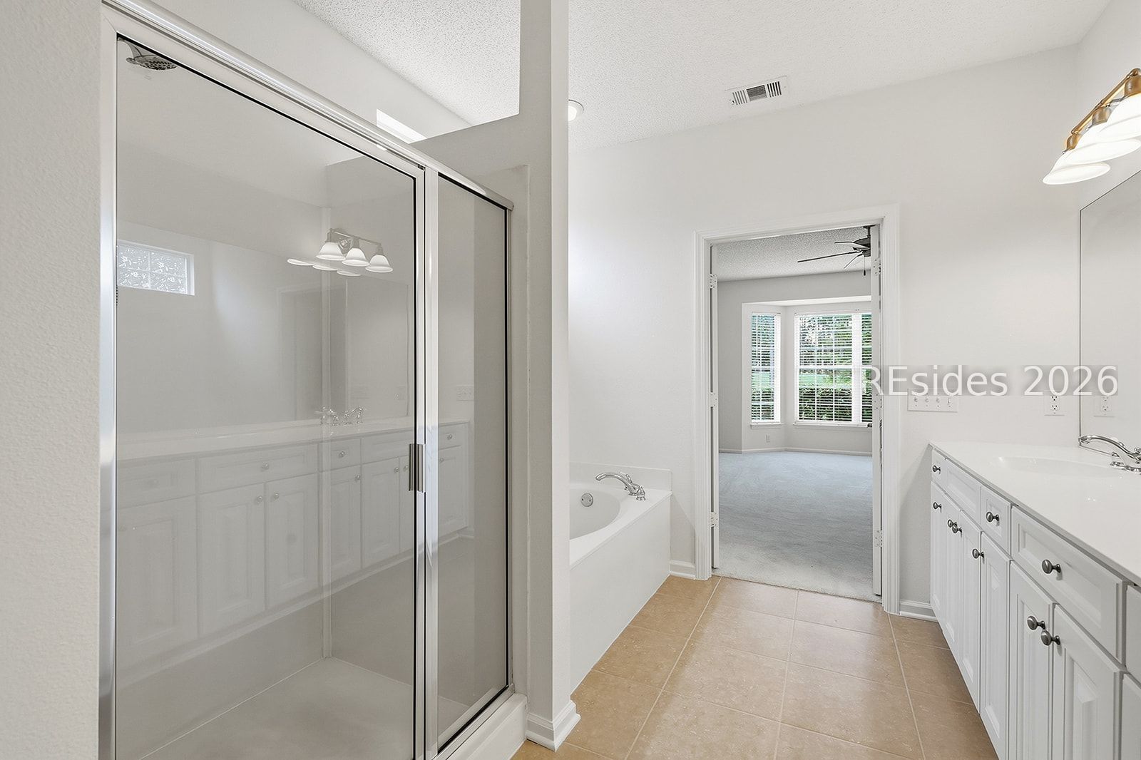 108 Landing Lane Bluffton, SC 29909 - Photo 44 of 63 Primary bath with walk in shower and soaking tub