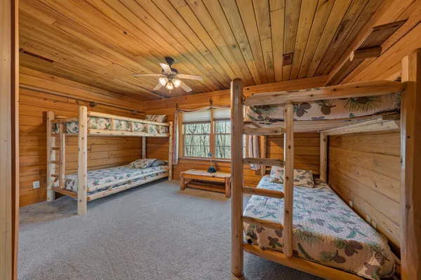a bedroom with furniture and a window