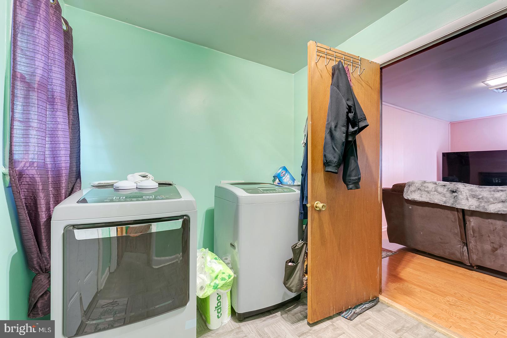 1211 Flamingo Road Salisbury, MD 21801 - Photo 37 of 63 Bright laundry nook with vibrant walls.